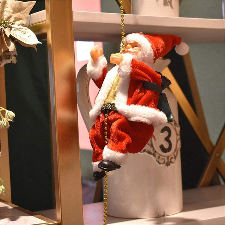 (🎉 Promozione di Natale Anticipata - 50% DI SCONTO 🎄) Babbo Natale Musicale con Corda Arrampicante